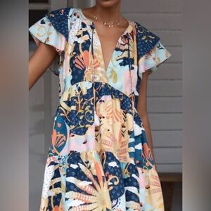 Anthropologie floral ruffle sleeve dress.